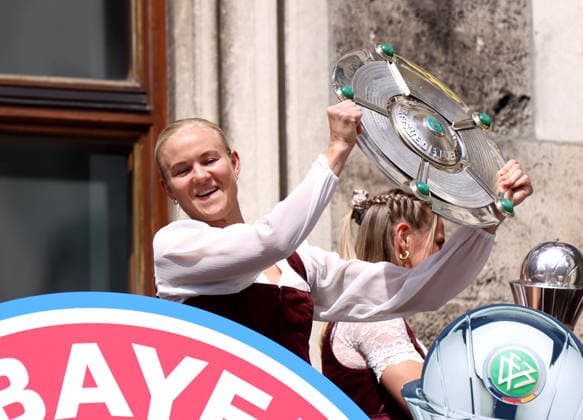 Football, Women, Bundesliga, Season 2025 2026, FC Bayern Munich, Women, Double celebration, Town hall balcony, Marienplatz Pernille Harder FC Bayern Munich with the championship trophy on the town hall balcony