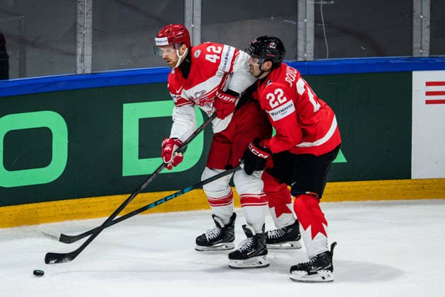 260518 Phillip Bruggisser of Denmark and Evan Bouchard of Canada during the 2026 IIHF Ice Hockey World Championship match between Canada and Denmark on May 18, 2026 in Fribourg Photo Jesper Zerman BILDBYRAN kod JZ JZ0718 ishockey ice hockey ishockey vm 2026 vm 2026 iihf world championship kanada canada danmark denmark canada kanada bbeng danmark denmark  Copyright: JESPERxZERMAN BB260518JZ087