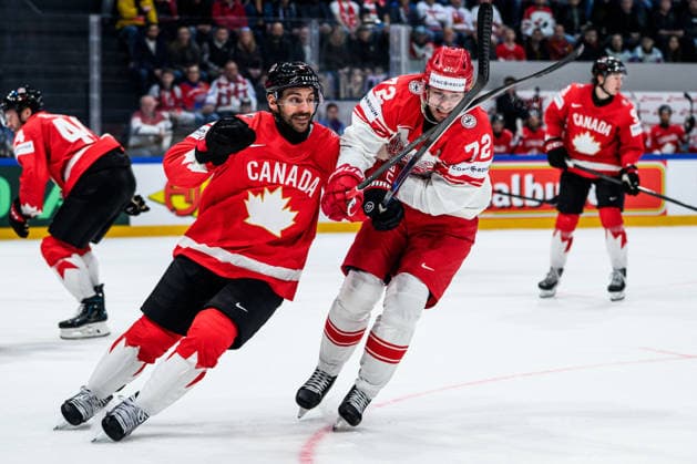 260518 Dylan Demelo of Canada and Phillip Schultz of Denmark during the 2026 IIHF Ice Hockey World Championship match between Canada and Denmark on May 18, 2026 in Fribourg Photo Jesper Zerman BILDBYRAN kod JZ JZ0718 ishockey ice hockey ishockey vm 2026 vm 2026 iihf world championship kanada canada danmark denmark canada kanada bbeng danmark denmark  Copyright: JESPERxZERMAN BB260518JZ097