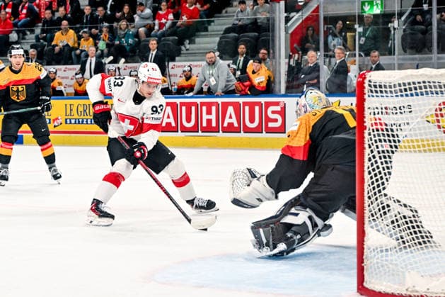 ZURICH, SWITZERLAND MAY 18 Theo Rochette of Switzerland in action against goalkeeper Jonas Stettmer of Germany during the 2026 IIHF Ice Hockey World Championship Switzerland game between Germany and Switzerland at Swiss Life Arena on May 18, 2026 in Zurich, Zurich Zurich Swiss Life Arena Zurich Switzerland Switzerland Copyright: xJustPictures.ch AndreaxBrancax jp-en-EuSpIm-JP7_ANB_Ger_Sui_18052026_1246
