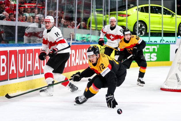 Ice hockey, Eishockey - IIHF WC 2026 ZURICH,SWITZERLAND,18.MAY.26 - ICE HOCKEY - IIHF Ice Hockey World Championship, WM, Weltmeisterschaft 2026, group stage, Germany vs Switzerland. Image shows Dean Kukan (SUI) and Dominik Kahun (GER).  GEPAxpictures xMaticxKlansek
