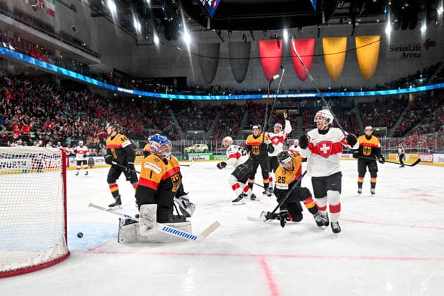 ZURICH, SWITZERLAND MAY 18 Christoph Bertschy of Switzerland R celebrates his goal scored against goalkeeper Jonas Stettmer of Germany L during the 2026 IIHF Ice Hockey World Championship Switzerland game between Germany and Switzerland at Swiss Life Arena on May 18, 2026 in Zurich, Zurich Zurich Swiss Life Arena Zurich Switzerland Switzerland Copyright: xJustPictures.ch AndreaxBrancax jp-en-EuSpIm-JP7_ANB_Ger_Sui_18052026_5519