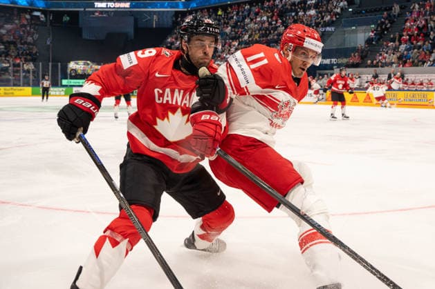 FRIBOURG, FRIBOURG - MAY 18: Parker Wotherspoon of Canada battles with Alexander True of Denmark during the 2026 IIHF World Championship, WM, Weltmeisterschaft Preliminary Round Group B match between Canada and Denmark at BCF Arena on May 18, 2026 in Fribourg, Fribourg, Switzerland. Copyright: xLivioxBaeriswylx xSPPx Sportspressphoto_SPR149934