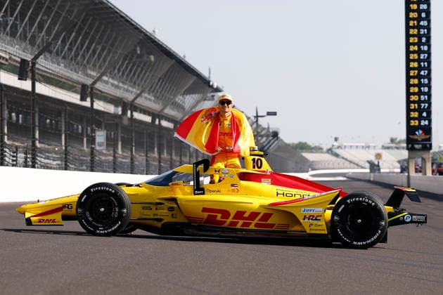 INDIANAPOLIS, IN - MAY 18: Pole sitter Alex Palou (10) Chip Ganassi Racing Honda with his country™s Spain flag and his P1 Trophy during the NTT IndyCar, Indy Car, IRL, USA Series Indianapolis 500 front row photoshoot at Indianapolis Motor Speedway in Indianapolis, IN. (Photo by Jeffrey Brown Icon Sportswire) AUTO: MAY 18 NTT IndyCar Series Indianapolis 500 Practice EDITORIAL USE ONLY Icon05126042