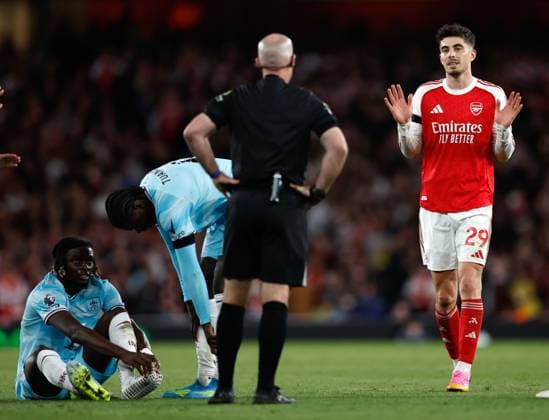 Kai Havertz of Arsenal fouls Lesley Ugochukwu of Burnley but protests his innocence to referee Paul Tierney Arsenal v Burnley, Football, Premier League, Emirates Stadium, Islington, London, UK - 18 05 2026 EDITORIAL USE ONLY No use with unauthorised audio, video, data, fixture lists, club league logos or live services. Online in-match use limited to 120 images, no video emulation. No use in betting, games or single club league player publications.  Copyright: xMattxImpey Shutterstockx 16882378z