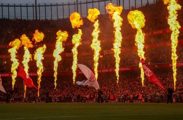 Flames going off by the side of the pitch and flags waved as the teams take to the pitch Arsenal v Burnley, Football, Premier League, Emirates Stadium, Islington, London, UK - 18 05 2026 EDITORIAL USE ONLY No use with unauthorised audio, video, data, fixture lists, club league logos or live services. Online in-match use limited to 120 images, no video emulation. No use in betting, games or single club league player publications.  Copyright: xMattxImpey Shutterstockx 16882378am