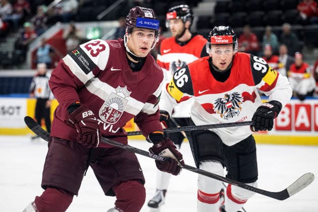 Latvia s Sandis Vilmanis (23) and Austria s Mario Huber (R) during the 2026 IIHF Ice hockey, Eishockey World Championships preliminary round group A match between Latvia and Austria in Zurich on May 18th, 2026. - RONI REKOMAA Zürich Switzerland dUC2bYISmXM  Copyright: xRonixRekomaax dUC2bYISmXM
