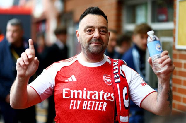 Arsenal fan with Manchester City bottle. AFC Bournemouth v Manchester City, Premier League, Football, Vitality Stadium, Bournemouth, UK - 19 May 2026Bournemouth Vitality Stadium United Kingdom EDITORIAL USE ONLY No use with unauthorised audio, video, data, fixture lists, club league logos or live services. Online in-match use limited to 120 images, no video emulation. No use in betting, games or single club league player publications.  Copyright: xJamesxMarsh Shutterstockx 16881288j