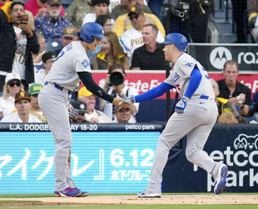 Baseball: Dodgers vs. Padres The Los Angeles Dodgers Freddie Freeman (R) is greeted by teammate Shohei Ohtani after hitting a two-run home run during the first inning of a baseball game against the San Diego Padres at Petco Park in San Diego, California, on May 19, 2026.  A14AA0005586786P