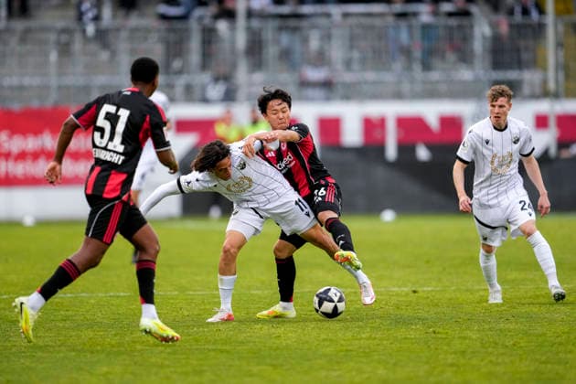 from left Davis Carlos Bautista Medina SGE, 51 , Luca De Meester SVS, 11 , Keita Kosugi SGE, 26 , Ken Gipson SVS, 24 , duel, duel scene, duel, tackle, tackling, dynamics, action, action, 20 05 2026, Sandhausen Germany , football, anniversary match, SV Sandhausen Eintracht Frankfurt xozx