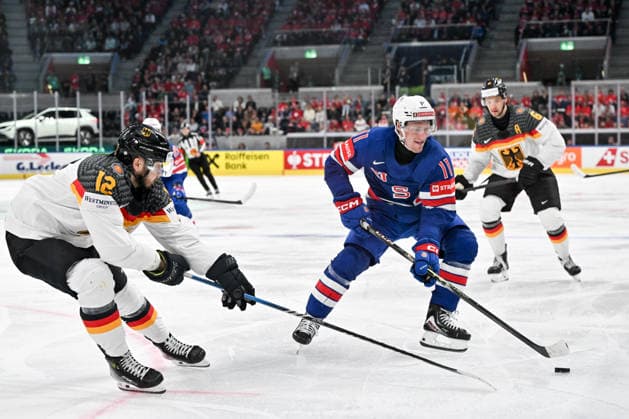 ZURICH, SWITZERLAND MAY 20 Oliver Moore of United States R protects the puck from Eric Mik of Germany L during the 2026 IIHF Ice Hockey World Championship Switzerland game between USA and Germany at Swiss Life Arena on May 20, 2026 in Zurich, Zurich Zurich Swiss Life Arena Zurich Switzerland Copyright: xJustPictures.ch AndreaxBrancax jp-en-EuSpIm-JP7_ANB_USA_Ger_20052026_8425
