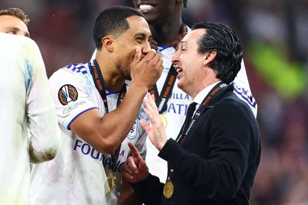 Youri Tielemans of Aston Villa (L) and Aston Villa manager Unai Emery (R) in front of the winners board SC Freiburg v Aston Villa, UEFA Europa League, Final, Football, Besiktas Park, Istanbul, Turkiye - 20 May 2026Istanbul Besiktas Park United Kingdom EDITORIAL USE ONLY No use with unauthorised audio, video, data, fixture lists, club league logos or live services. Online in-match use limited to 120 images, no video emulation. No use in betting, games or single club league player publications.  Copyright: xJamesxMarsh Shutterstockx 16883157hi
