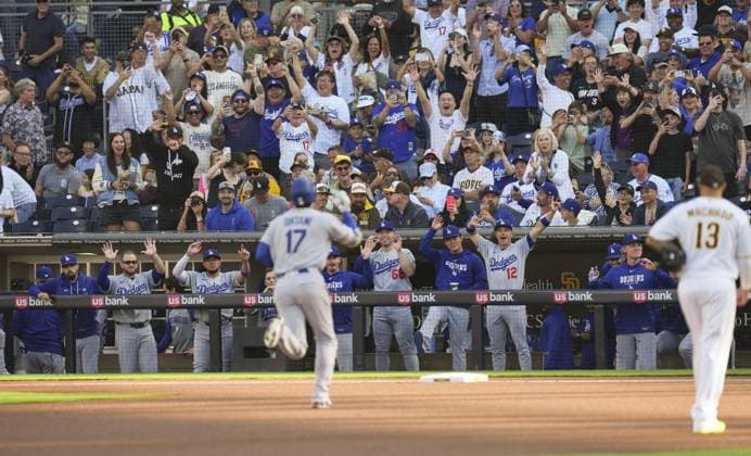 Baseball: Dodgers vs. Padres Los Angeles Dodgers two-way player Shohei Ohtani (17) rounds the bases after hitting a solo home run as teammates cheer in the dugout in the first inning of a baseball game against the San Diego Padres at Petco Park in San Diego, California, on May 20, 2026.  A14AA0005592396P