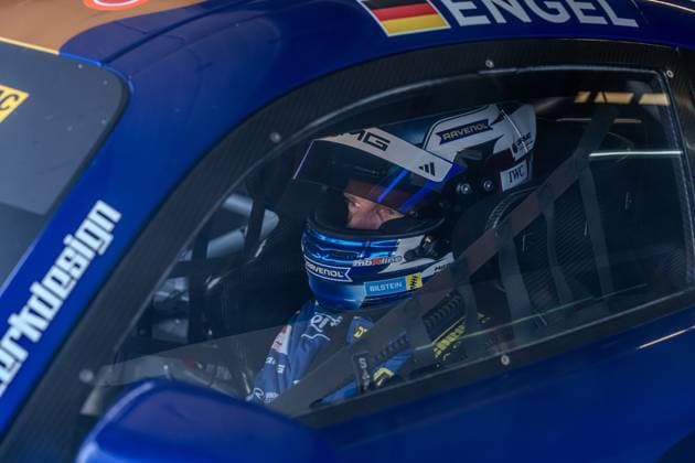 The Mercedes AMG GT3 80 from Mercedes AMG Team Winward with driver Maro Engel in the drivers cab The driver wears a helmet with RAVENOL and IWC sponsorships, the car is painted blue with white accents and BILSTEIN branding Maro Engel in the Mercedes AMG GT3 80 at Circuit Park Zandvoort Copyright: xMichaelxSchäferx