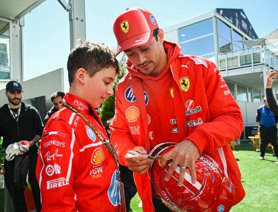 May 22, 2026, Montreal, Qc, CANADA: Ferrari driver Charles Leclerc, right, of Monaco, signs an autograph for Atticus Ianiro at the Formula One auto racing Canadian Grand Prix in Montreal on Friday, May 22, 2026. Canada News - May 22, 2026  - ZUMAc35_ 20260522_zaf_c35_024 Copyright: xGrahamxHughesx