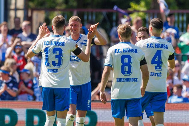 Goalscorer Emil Frost Holten Rostock to 2 0 cheers and is happy about his goal with f l Lukas Kunze Rostock , Cedric Harenbrock Rostock and Kenan Fatkic Rostock GER, FC Hansa Rostock vs SV Pastow, Football, Men, Lübzer Pils Landespokal, Final, Season 2025 2026, 23 05 2026 Greifswald Volksstadion Mecklenburg Vorpommern Germany