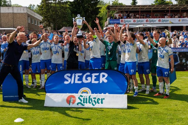 on the left, caretaker Andreas Thiem Rostock and Franz Pfanne Rostock with the winners trophy GER, FC Hansa Rostock vs SV Pastow, soccer, men, Lübzer Pils Landespokal, final, season 2025 2026, 23 05 2026 Greifswald Volksstadion Mecklenburg Vorpommern Germany