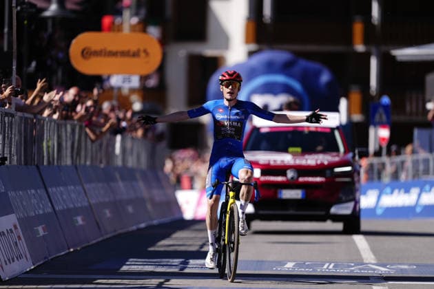 The blue jersey Denmark™s Jonas Vingegaard Hansen of Team Visma Lease A Bike celebrates as he cycles to the finish line to win during Stage 14 of the Giro d™Italia, from Aosta to Pila, Italy, Saturday, May 23, 2026.  Copyright: xFabioxFerrari LaPressex