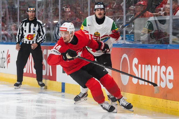 ZURICH, ZURICH - MAY 23: Dean Kukan of Switzerland battles with Bence Horvath of Hungary during the 2026 IIHF World Championship, WM, Weltmeisterschaft Preliminary Round Group A match between Switzerland and Hungary at Swiss Life Arena on May 23, 2026 in Zurich, Zurich, Switzerland. Copyright: xLivioxBaeriswylx xSPPx Sportspressphoto_152912
