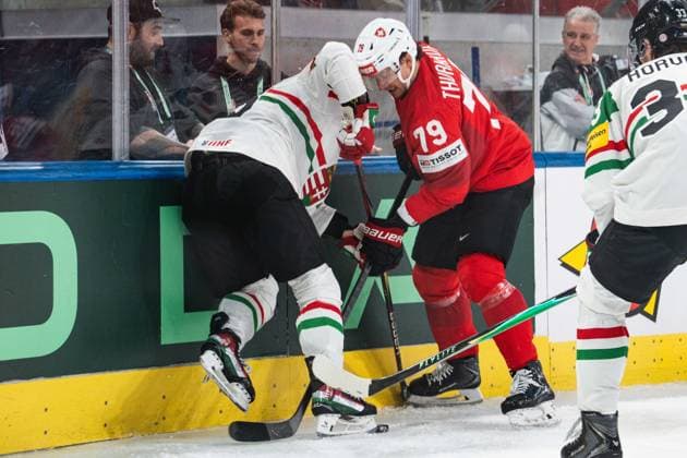 ZURICH, ZURICH - MAY 23: Calvin Thürkauf of Switzerland protects the puck against Hungary players during the 2026 IIHF World Championship, WM, Weltmeisterschaft Preliminary Round Group A match between Switzerland and Hungary at Swiss Life Arena on May 23, 2026 in Zurich, Zurich, Switzerland. Copyright: xLivioxBaeriswylx xSPPx Sportspressphoto_152950