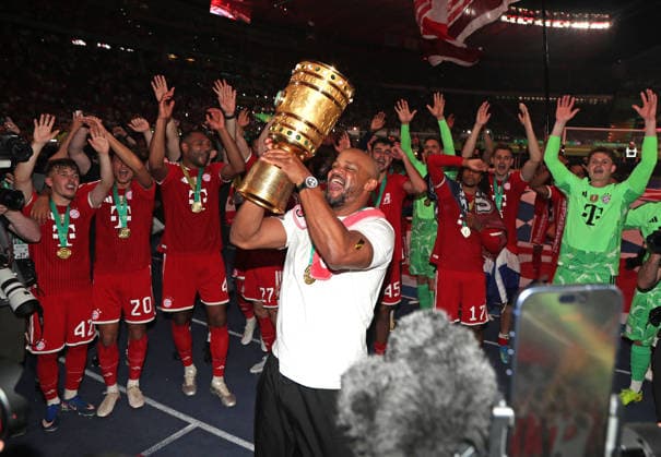 Football, Men, DFB Cup Final, Season 2025 2026, FC Bayern Munich VFB Stuttgart, Olympiastadion Berlin The FC Bayern Munich team celebrates winning the DFB Cup here after the game, in the picture Vincent Kompany, coach FC Bayern Munich with the cup while cheering in front of the fan curve DFB, DFL regulations prohibit any use of photographs as image sequences and or quasi video
