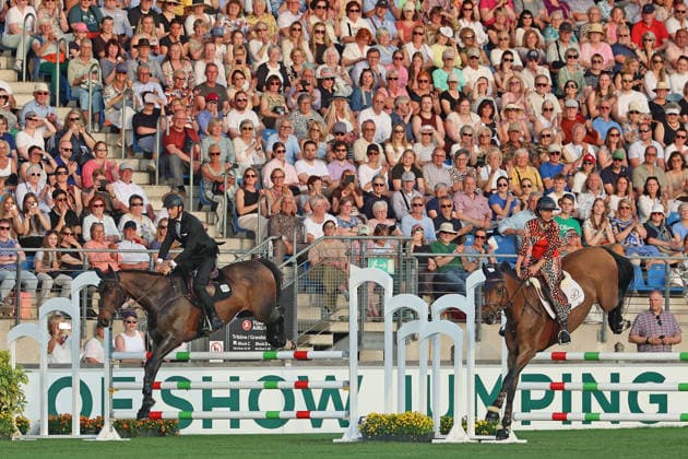 Richard Vogel and Luciana Diniz together in Bond Stunt Feeling over the obstacles, concert horse symphony, supporting program, motto of the evening James Bond, World Equestrian Festival, TSCHIO Aachen 2026, TSCHIO instead of CHIO 2026, Aachener Soers, 22 to 24 May 2026, equestrian sport, 23 05 2026, Aachener Soers Germany