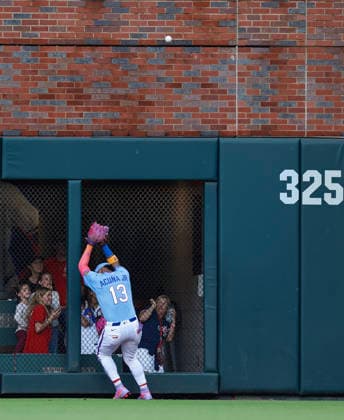 Right fielder Ronald Acuna, Jr. 13 of the Atlanta Braves misplays a ball that hit the outfield wall during the game against the Washington Nationals at Truist Park on Saturday, May 23, 2026 in Atlanta, Georgia.  ATL20260523114 MikexZarrilli