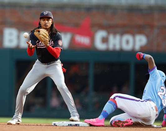 Centerfielder Michael Harris II 23 of the Atlanta Braves slides into second base to beat the throw to shortstop CJ Abrams 5 of the Washington Nationals in the seventh inning during the game at Truist Park on Saturday, May 23, 2026 in Atlanta, Georgia.  ATL20260523127 MikexZarrilli