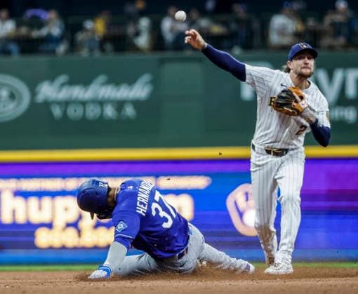 Milwaukee Brewers second baseman Brice Turang (R) forces out Los Angeles Dodgers left fielder Teoscar Hernandez (L) and turns a double play on Los Angeles Dodgers shortstop Miguel Rojas in the sixth inning of the MLB, Baseball Herren, USA game between the Los Angeles Dodgers and the Milwaukee Brewers at American Family Field in Milwaukee, Wisconsin on Saturday, May 23, 2026.  MIL20260523826 TANNENxMAURY