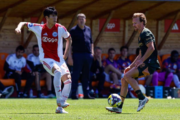 2026-05-24 AFC Ajax v FC Utrecht - Dutch Eredivisie Play-Offs VOLENDAM, NETHERLANDS - MAY 24: Takehiro Tomiyasu of AFC Ajax battles for possession with Dani de Wit of FC Utrecht during the Dutch Eredivisie Play-Offs match between AFC Ajax and FC Utrecht at Kras Stadion on May 24, 2026 in Volendam, Netherlands. Volendam Kras Stadion Netherlands Content not available for redistribution in The Netherlands directly or indirectly through any third parties. Copyright: xBenxGalx