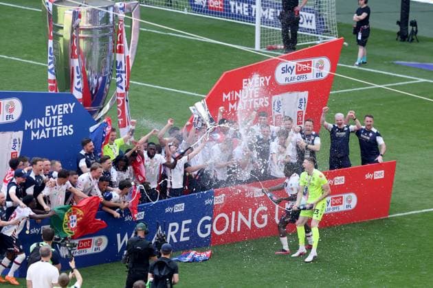 Bolton Wanderers celebrate with the trophy after winning the EFL Championship Play-off Final and promotion to the Premier League Bolton Wanderers v Stockport County, EFL Sky Bet League One, Play-Off Final, Football, Wembley Stadium, London, UK - 24 May 2026London Wembley Stadium United Kingdom EDITORIAL USE ONLY No use with unauthorised audio, video, data, fixture lists, club league logos or live services. Online in-match use limited to 120 images, no video emulation. No use in betting, games or single club league player publications.  Copyright: xIanxTuttle Shutterstockx 16889808du