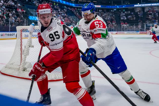 FRIBOURG, SWITZERLAND MAY 24 Nick Olesen of Denmark L against Alex Trivellato of Italy R during the 2026 IIHF Ice Hockey World Championship Switzerland game between Denmark and Italy at BCF Arena on May 24, 2026 in Fribourg, Fribourg Fribourg BCF Arena Fribourg Switzerland Copyright: xJustPictures.ch JarixPestelaccix jp-en-EuSpIm-JP6_JAR_Denmark_Italy_24May2026_00024