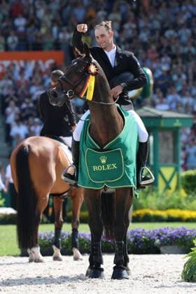 Winner, 1 place, Richard Vogel GER with horse United Touch S, Rolex Grand Slam of Show Jumping, award ceremony, pointing to his horse by Richard Vogel, show jumping competition with two rounds and jump-off, World Equestrian Festival, World Equestrian Festival, TSCHIO Aachen 2026, TSCHIO instead of CHIO 2026, Aachener Soers, May 22 to 24, 2026, equestrian sport, May 24, 2026, Aachener Soers Germany
