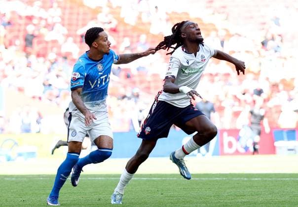 Josh Dacres-Cogley of Stockport County pulls the hair of Ibrahim Cissoko of Bolton Wanderers Bolton Wanderers v Stockport County, EFL Sky Bet League One, Play-Off Final, Football, Wembley Stadium, London, UK - 24 May 2026London Wembley Stadium United Kingdom EDITORIAL USE ONLY No use with unauthorised audio, video, data, fixture lists, club league logos or live services. Online in-match use limited to 120 images, no video emulation. No use in betting, games or single club league player publications.  Copyright: xSimonxDael Shutterstockx 16889811ht