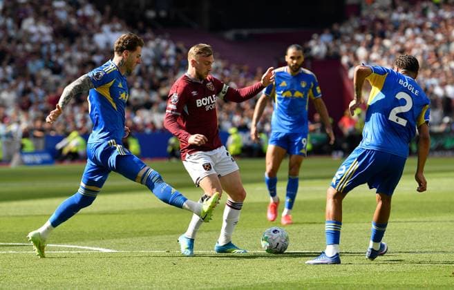 Jarrod Bowen of West Ham United in action with Joe Rodon Jayden Bogle of Leeds United West Ham United v Leeds United, Premier League, Football, London Stadium, London, UK - 24 May 2026London London Stadium United Kingdom EDITORIAL USE ONLY No use with unauthorised audio, video, data, fixture lists, club league logos or live services. Online in-match use limited to 120 images, no video emulation. No use in betting, games or single club league player publications.  Copyright: xAlanxWalter Shutterstockx 16889881n