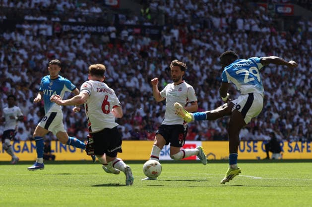 LONDON, ENGLAND - MAY 24: Adama Sidibeh of Stockport County takes a shot during the Sky Bet League One Play-Off Final match between Bolton Wanderers and Stockport County at Wembley Stadium on May 24, 2026 in London, England.  Copyright: xMBxMediax