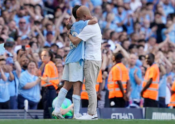 Manchester, England, 24th May 2026. Emotional Bernardo Silva of Manchester City and Pep Guardiola coach of Manchester City exchange hugs bother are leaving the club during the Manchester City vs Aston Villa Premier League match at the Etihad Stadium, Manchester. Picture credit should read: Andrew Yates Sportimage EDITORIAL USE ONLY. No use with unauthorised audio, video, data, fixture lists, club league logos or live services. Online in-match use limited to 120 images, no video emulation. No use in betting, games or single club league player publications. SPI_047_AY_Man_City_Villa SPI-4819-0052