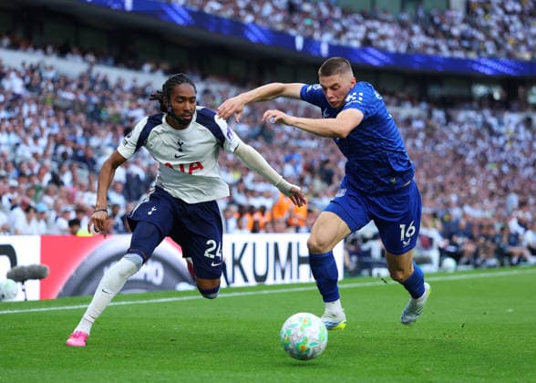 24th May 2026; Tottenham Hotspur Stadium, London, England; Premier League Football, Tottenham Hotspur versus Everton; Djed Spence of Tottenham Hotspur under pressure from Vitaliy Mykolenko of Everton JPxFletcher