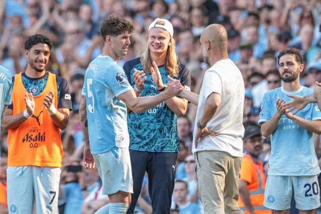 Premier League: Manchester City vs Aston Villa John Stones of Manchester City shakes hands with Pep Guardiola manager of Manchester City after he™s leaves the field of play to a standing ovation as fans sing, ˜Jonny Stones™ during the Premier League match Manchester City vs Aston Villa at Etihad Stadium, Manchester, United Kingdom on 24 May 2026 (Photo by Mark Cosgrove News Images) Manchester Etihad Stadium Greater Manchester United, ManU Kingdom Copyright: xMarkxCosgrove NewsxImagesx