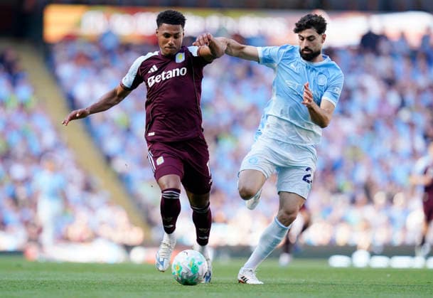 Manchester, England, 24th May 2026. Ollie Watkins of Aston Villa tussles with Josko Gvardiol of Manchester City during the Manchester City vs Aston Villa Premier League match at the Etihad Stadium, Manchester. Picture credit should read: Andrew Yates Sportimage EDITORIAL USE ONLY. No use with unauthorised audio, video, data, fixture lists, club league logos or live services. Online in-match use limited to 120 images, no video emulation. No use in betting, games or single club league player publications. SPI_068_AY_Man_City_Villa SPI-4819-0073