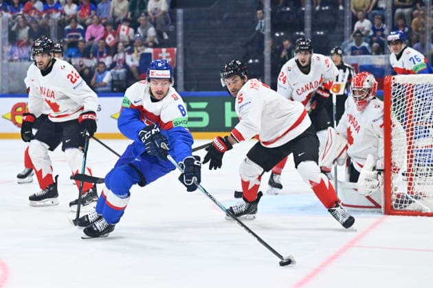 L-R Evan Bouchard (CAN), Oliver Okuliar (SVK), Denton Mateychuk (CAN) and goalkeeper Jet Greaves (CAN) in action during to the group B match of the World Ice hockey, Eishockey Championship, Slovakia - Canada, Fribourg, Switzerland, on May 24, 2026. (CTKxPhoto RadekxPetrasek) CTKPhotoP2026052406458  CTKPhotoP2026052406458