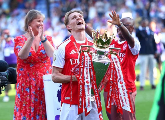 London, England, 24th May 2026. Martin Odegaard of Arsenal holds the Premier League trophy during the Crystal Palace vs Arsenal Premier League match at Selhurst Park, London. Picture credit should read: Paul Terry Sportimage EDITORIAL USE ONLY. No use with unauthorised audio, video, data, fixture lists, club league logos or live services. Online in-match use limited to 120 images, no video emulation. No use in betting, games or single club league player publications. SPI_079_PT_Palace_Arsenal SPI-4818-0079