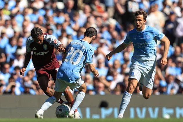 24th May 2026; Etihad Stadium, Manchester, Lancashire, England; Premier League Football, Manchester City versus Aston Villa; Leon Bailey of Aston Villa is tackled by Bernardo Silva of Manchester City DavidxBlunsden