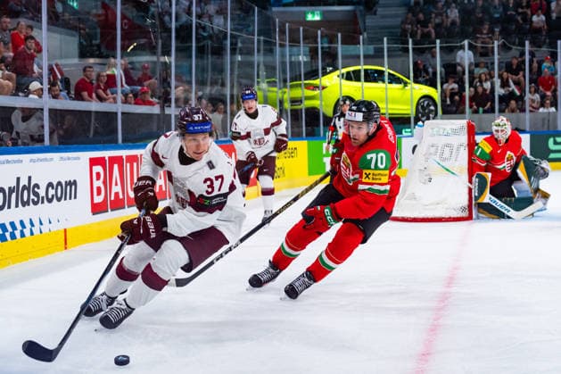 ZURICH, SWITZERLAND - MAY 26: Oskars Lapinskis (Latvia, 37) in the battle for the puck with Zsombor Garat (Hungary, 70) during the Preliminary Round - Group A Match 51 between Hungary and Latvia at the IIHF Ice hockey, Eishockey World Championship, WM, Weltmeisterschaft 2026, Swiss Life Arena on May 26, 2026 in Zurich, Switzerland. Zurich Switzerland Copyright: xTimoxSteinx