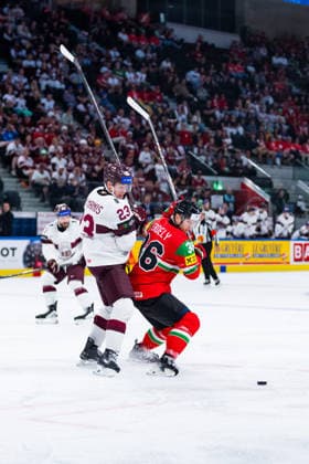 ZURICH, SWITZERLAND - MAY 26: Csanad Erdely (Hungary, 36) in the battle for the puck with Sandis Vilmanis (Latvia, 23) during the Preliminary Round - Group A Match 51 between Hungary and Latvia at the IIHF Ice hockey, Eishockey World Championship, WM, Weltmeisterschaft 2026, Swiss Life Arena on May 26, 2026 in Zurich, Switzerland. Zurich Switzerland Copyright: xTimoxSteinx