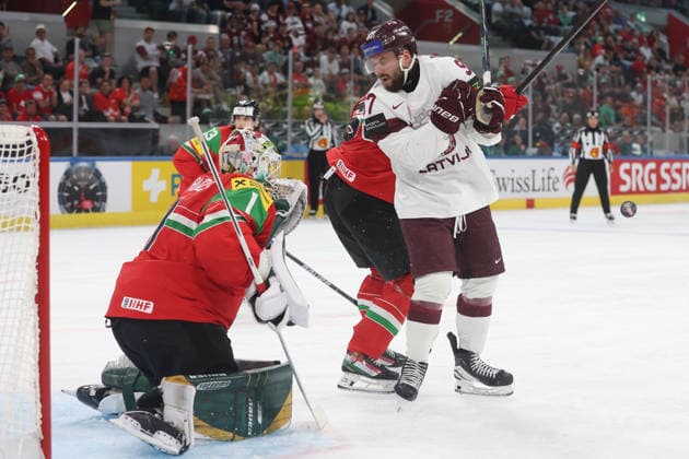 26 05 2026 Swiss Life Arena Zurich , SWITZERLAND, Mens Ice Hockey IIHF World Championship Zurich 2026 Group A HUN LAT Haralds Egle LAT in front of goaltender Bence Balizs HUN