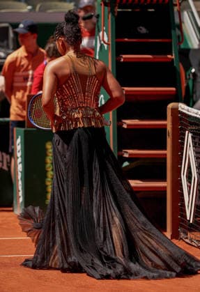 Naomi Osaka of Japan wears a gold sequinned dress under a black sequinned long skirt and corset French Open Tennis, Day Three, Tennis, Roland Garros, Paris, France - 26 May 2026Paris Roland Garros France EDITORIAL USE ONLY No use with unauthorised audio, video, data, fixture lists, club league logos or live services. Online in-match use limited to 120 images, no video emulation. No use in betting, games or single club league player publications.  Copyright: xEllaxLing Shutterstockx 16898259r
