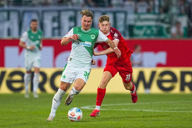 26 05 2026, xydrx, Men, Soccer, Relegation second leg, 2 Bundesliga, SpVgg Greuther Fürth Rot Weiss Essen, Season 2025 2026, Sportpark Ronhof Felix Klaus SpVgg Greuther Fürth, 30 in duel against Gianluca Swajkowski Rot Weiss Essen, 39 DFB regulations prohibit any use of photographs as image sequences and or quasi video Copyright: HMBxMedia YannisxDreimann