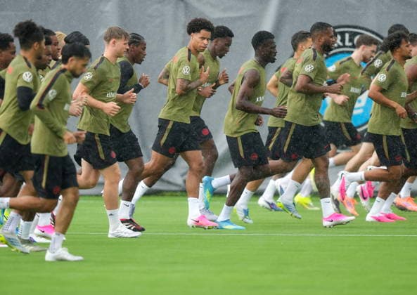 May 26, 2026, Charlotte, Nc, UNITED STATES: Tajon Buchanan, centre, runs in the rain with his teammates during Team Canada World Cup roster selection camp in Charlotte, N.C., on Tuesday, May 26, 2026. Canada News - May 26, 2026 - ZUMAc35_ 20260526_zaf_c35_078 Copyright: xNathanxDenettex