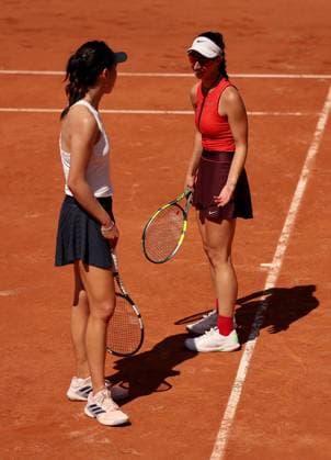 Xinyu Wang of China and Tamara Korpatsch of Germany argue a line call on the same side of the court French Open Tennis, Day Four, Tennis, Roland Garros, Paris, France - 27 May 2026Paris Roland Garros France EDITORIAL USE ONLY No use with unauthorised audio, video, data, fixture lists, club league logos or live services. Online in-match use limited to 120 images, no video emulation. No use in betting, games or single club league player publications.  Copyright: xEllaxLing Shutterstockx 16898262do